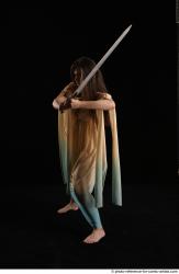 Woman Adult Average Fighting with sword Standing poses Casual Latino
